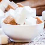 Pieces of white and brown sugar, selective focus