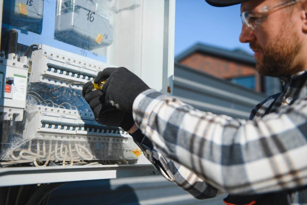 Professional Emergency Electrician testing switchboard safety